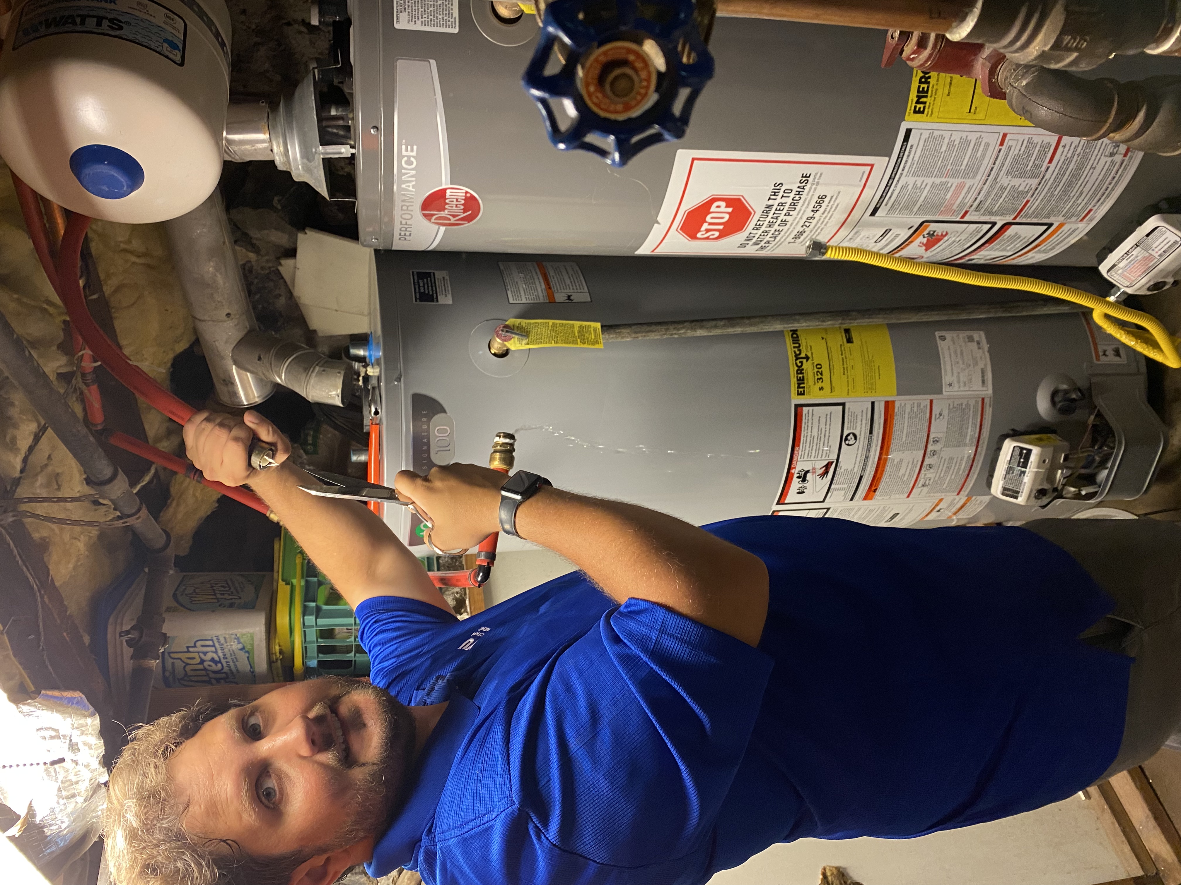 Victor Moxley working on home maintenance